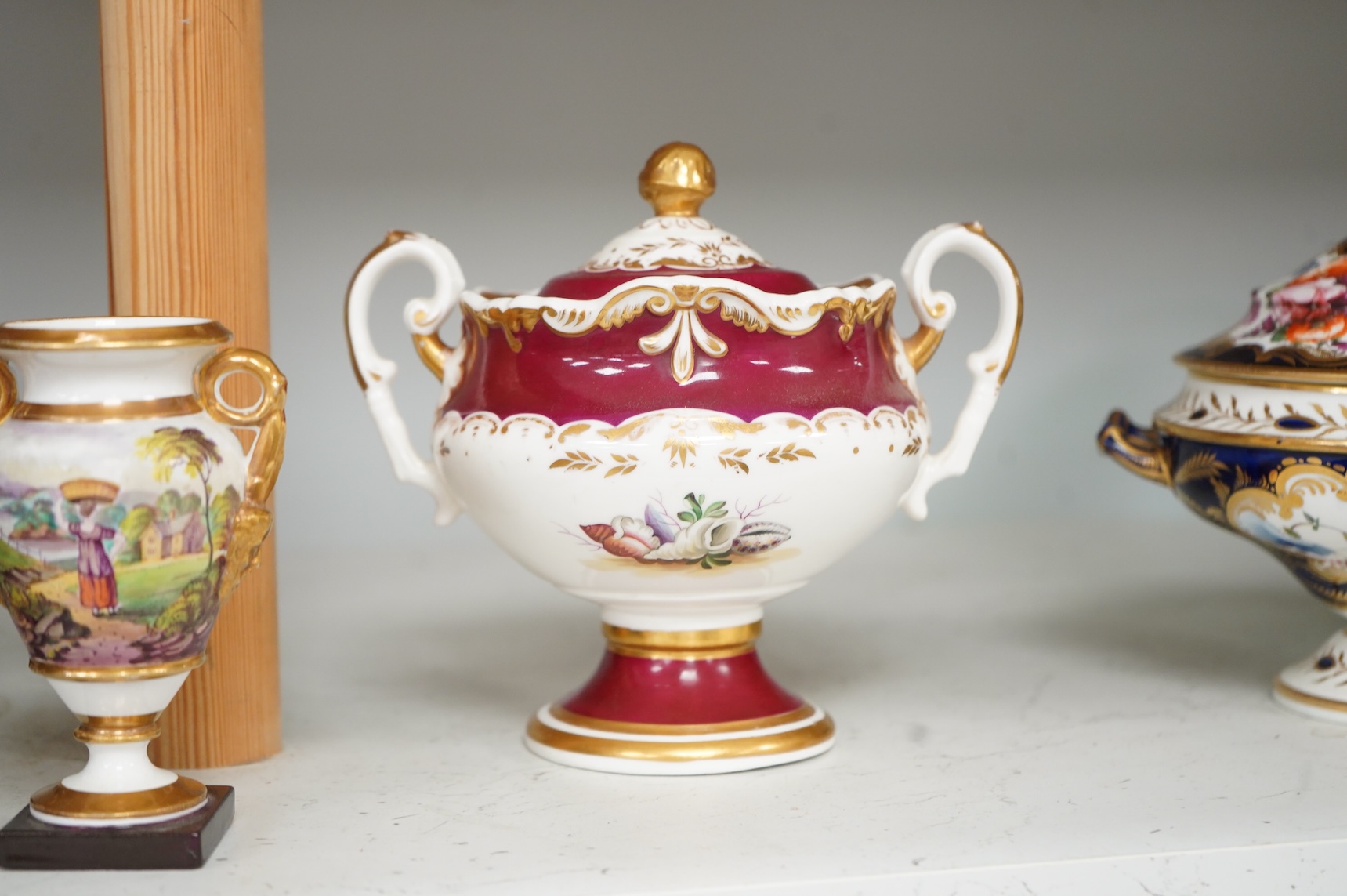A Group of early 19th century English porcelain; to sauce tureens and covers, one with stand, a covered sugar bowl, a two handled vase, a pot pourri vase and cover, a milk jug and a hydra shaped jug, largest 16cm high